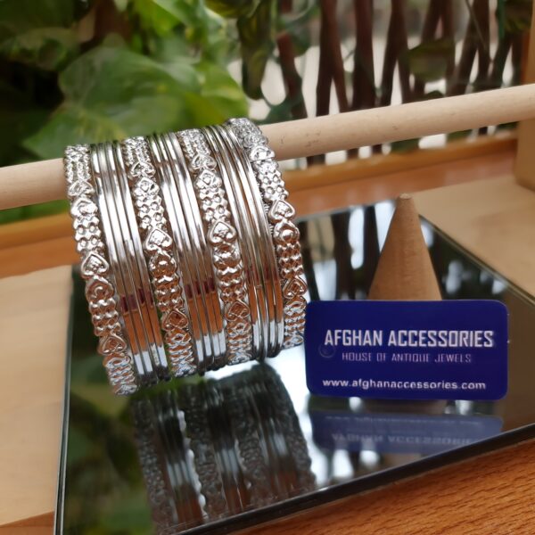 Antique Carved Metallic Bangles Set with Intricate Traditional Detailing